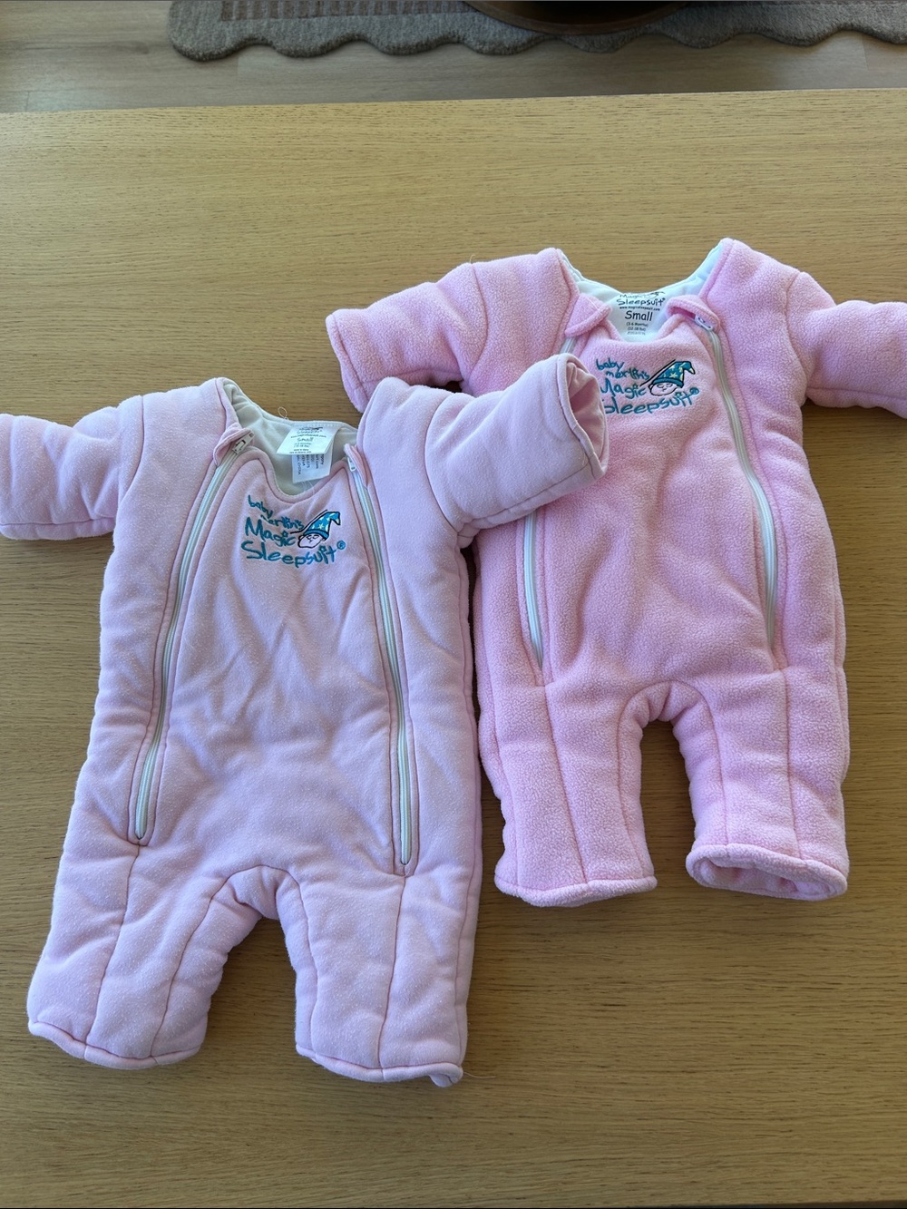 2 pink magic Merlin sleep suits size small 3-6m